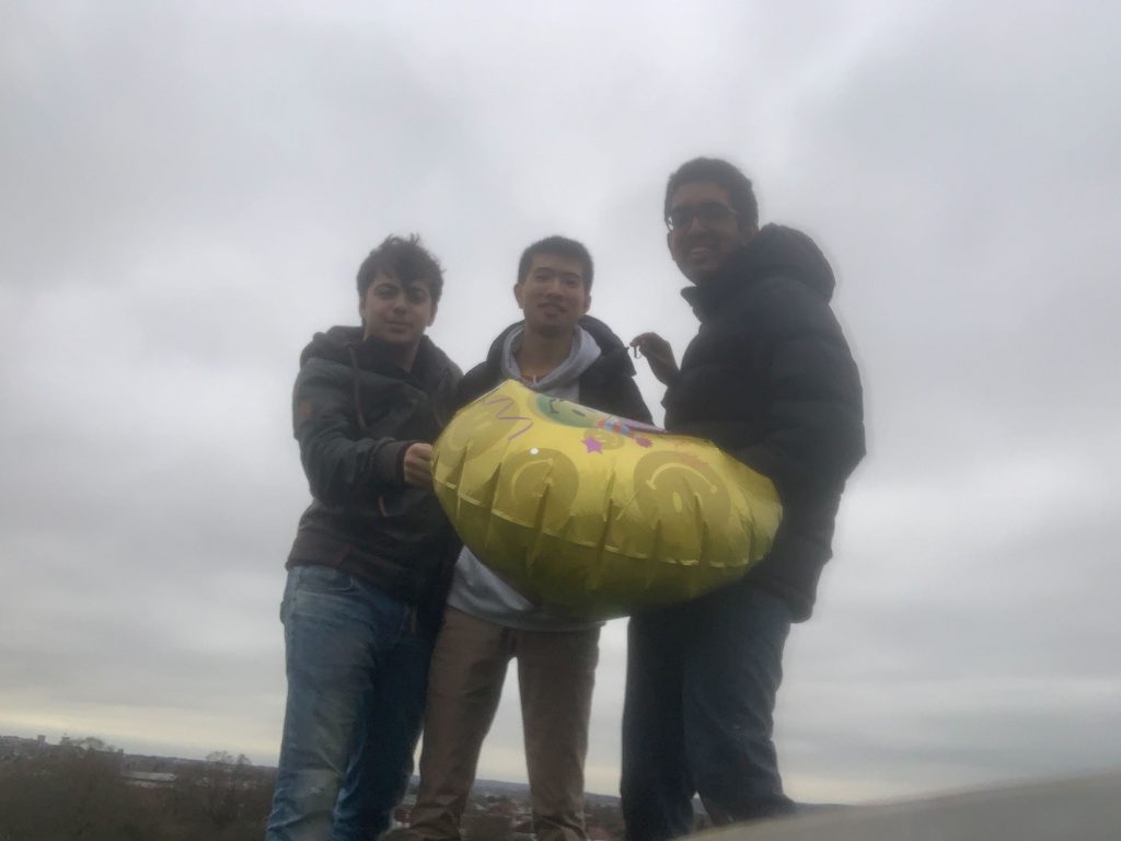 People smiling with balloon